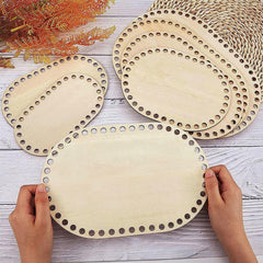 Wooden circular cutouts with holes on a wooden surface