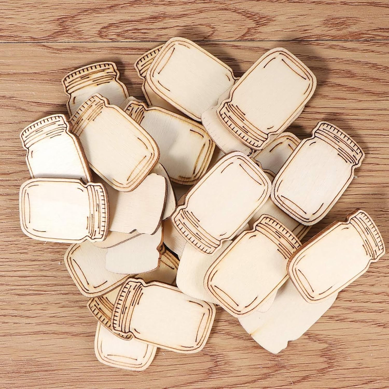 Wooden cutout shapes of jars on a wooden surface