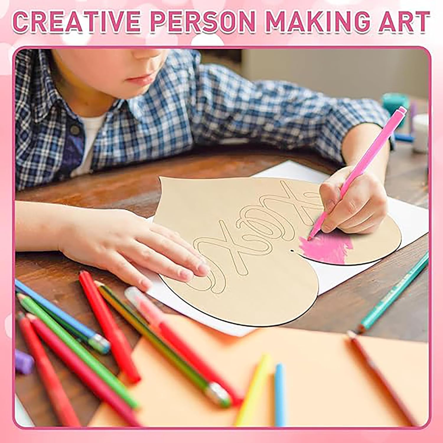 Person making art with colored pencils on a wooden table