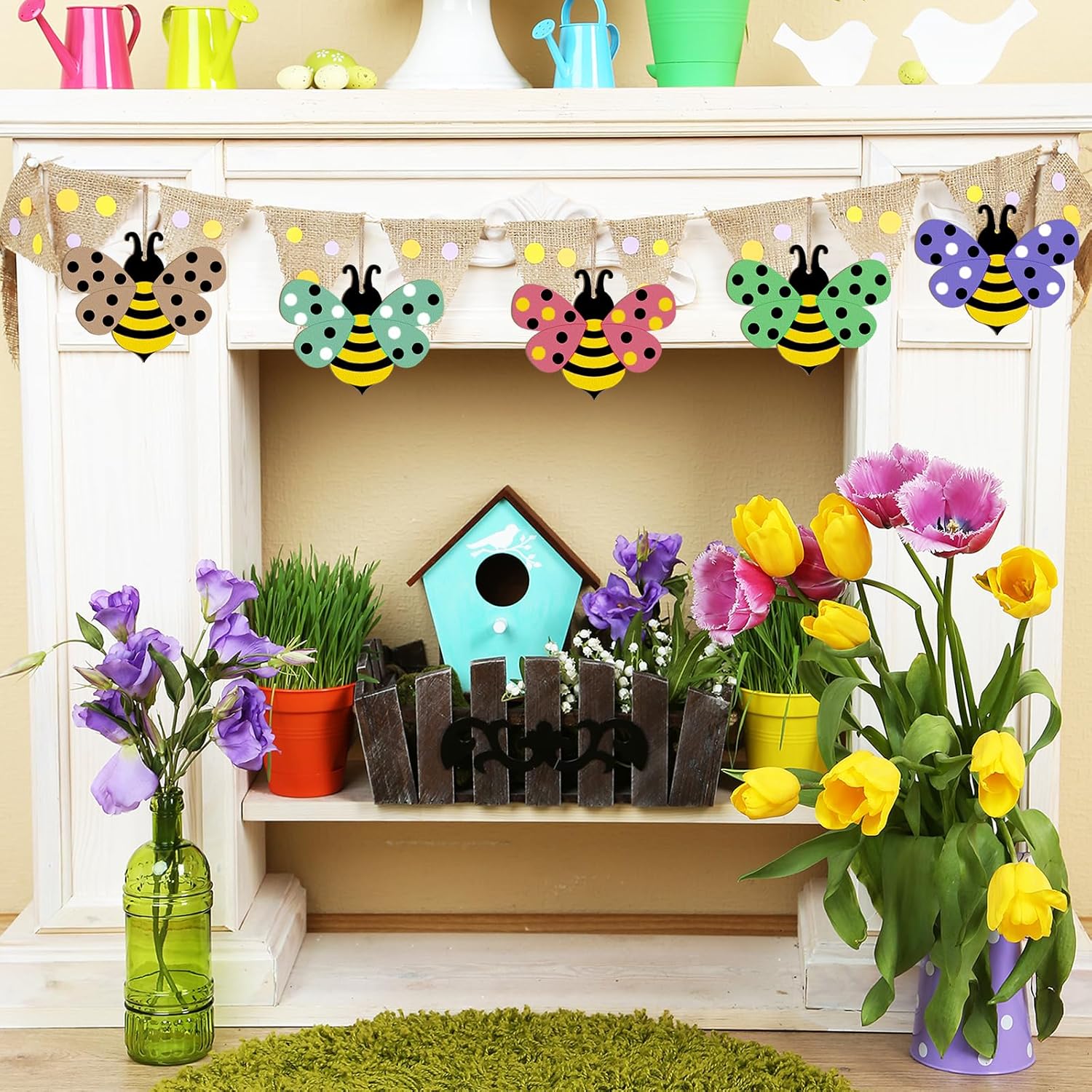 Decorative shelf with colorful flowers, birdhouse, and bee-themed banner.