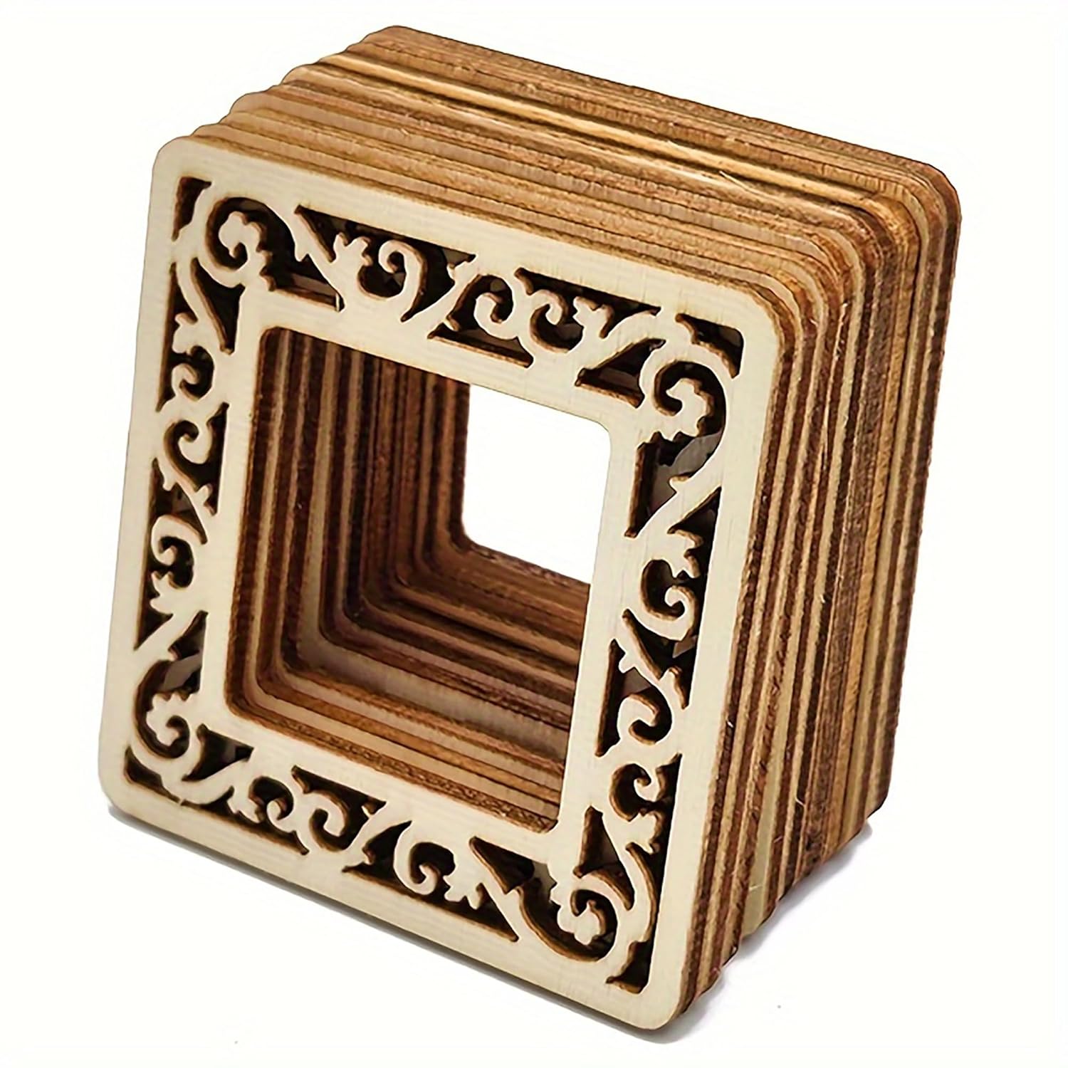 Wooden square block with intricate carvings on a white background
