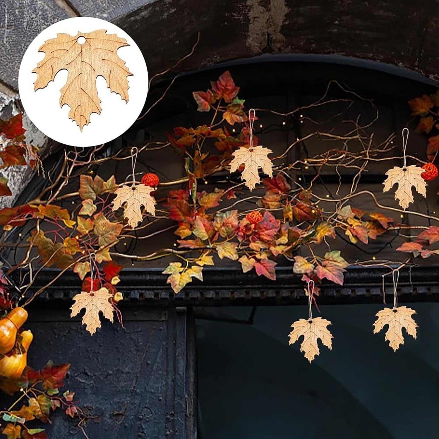 Decorative autumn leaf garland with a close-up of a leaf on a dark background.