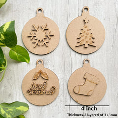 Four wooden Christmas ornaments with snowflake, tree, wreath, and stocking designs on a light wooden surface.