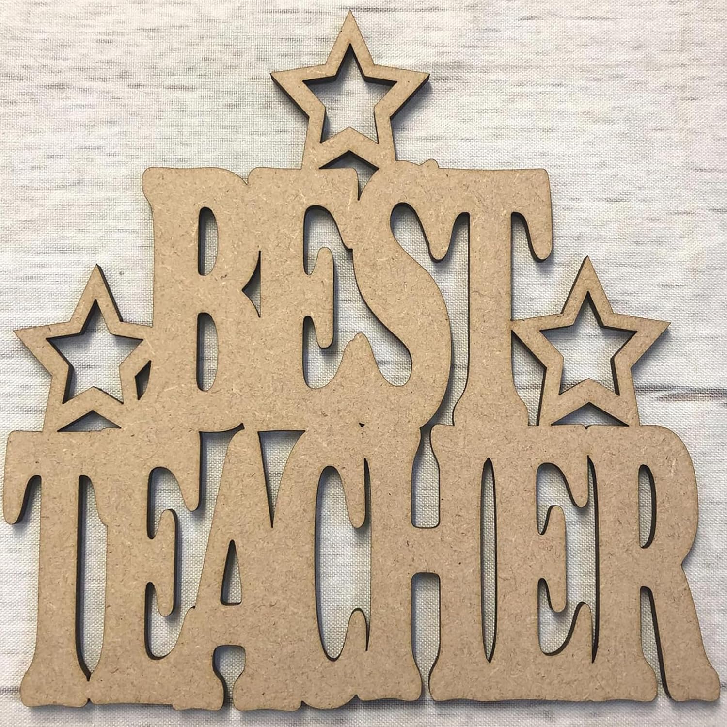 Wooden cutout letters spelling 'BEST TEACHER' with star shapes on a textured background