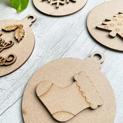 Wooden Christmas ornaments on a light wooden surface