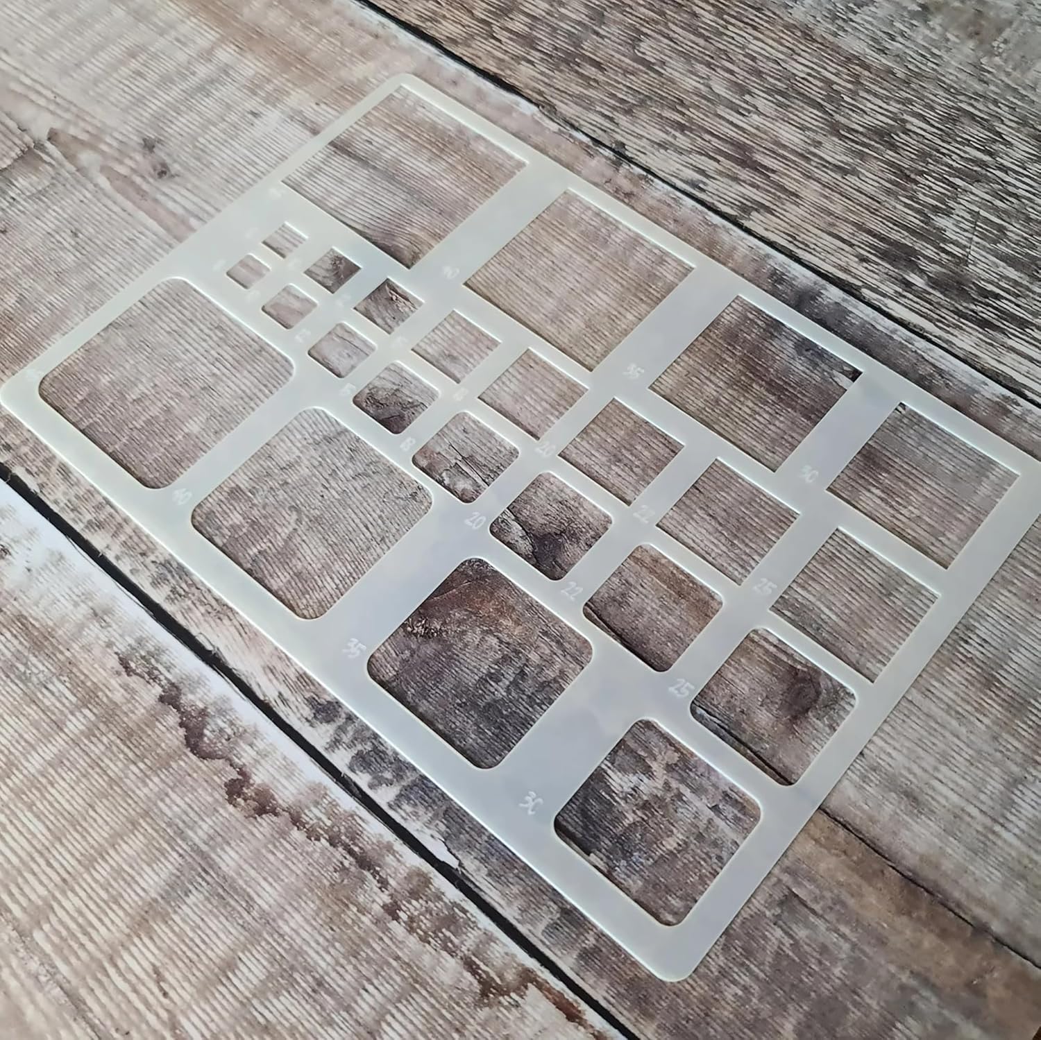 Square patterned stencil on a wooden surface