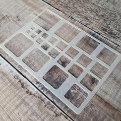 Square patterned stencil on a wooden surface