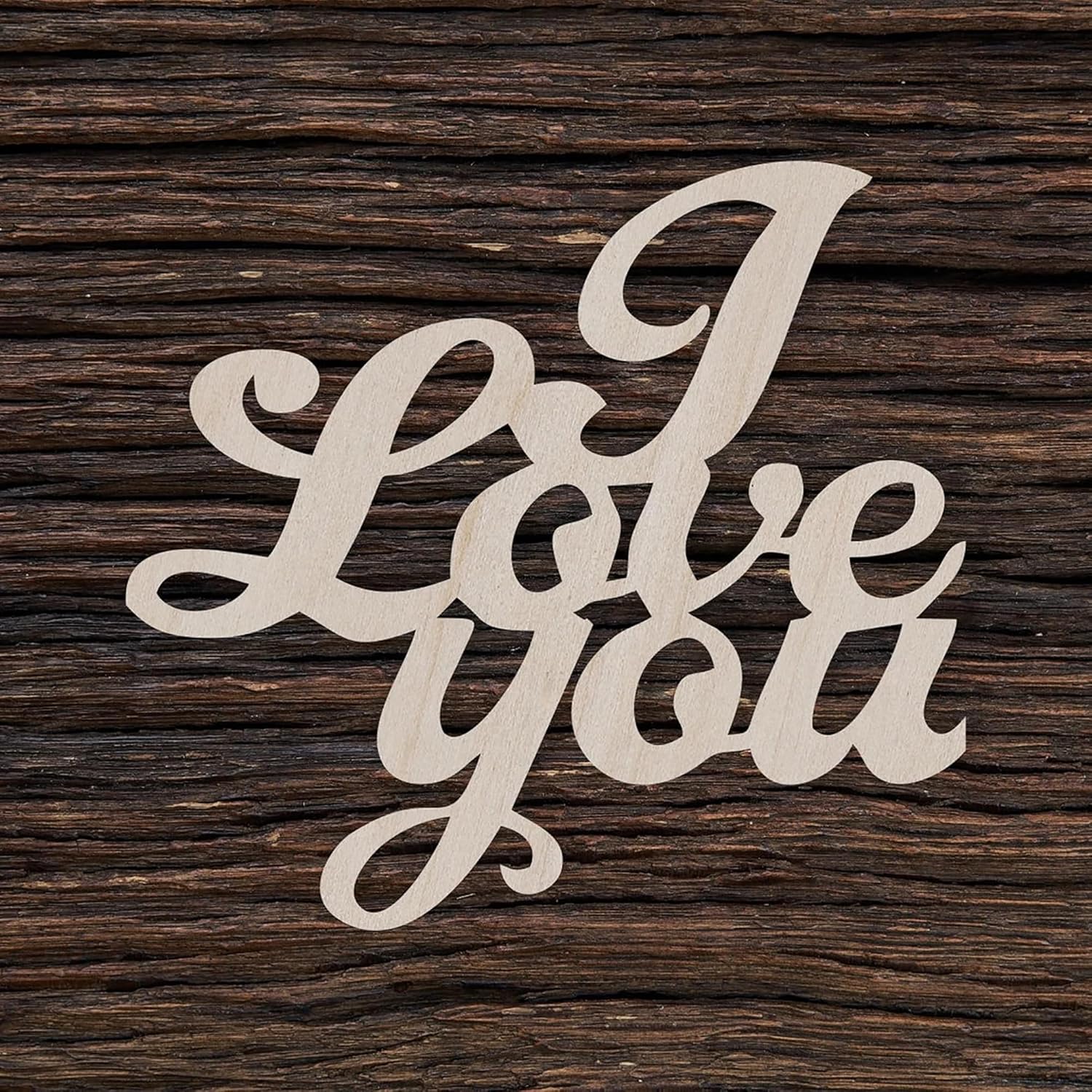 Wooden cutout of 'I Love You' on a wooden background
