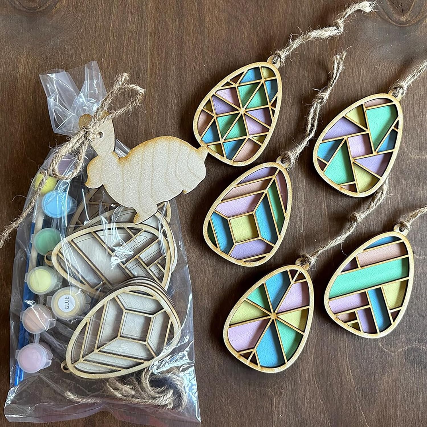 Decorative wooden ornaments with geometric patterns on a wooden surface