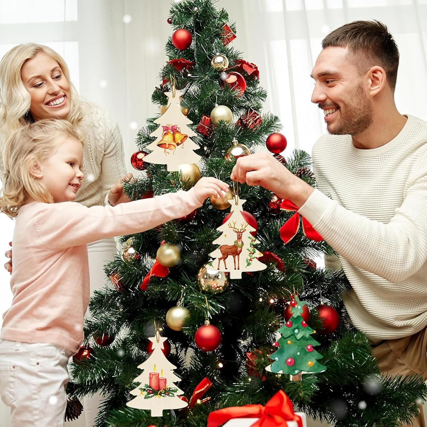 Family decorating a Christmas tree with ornaments