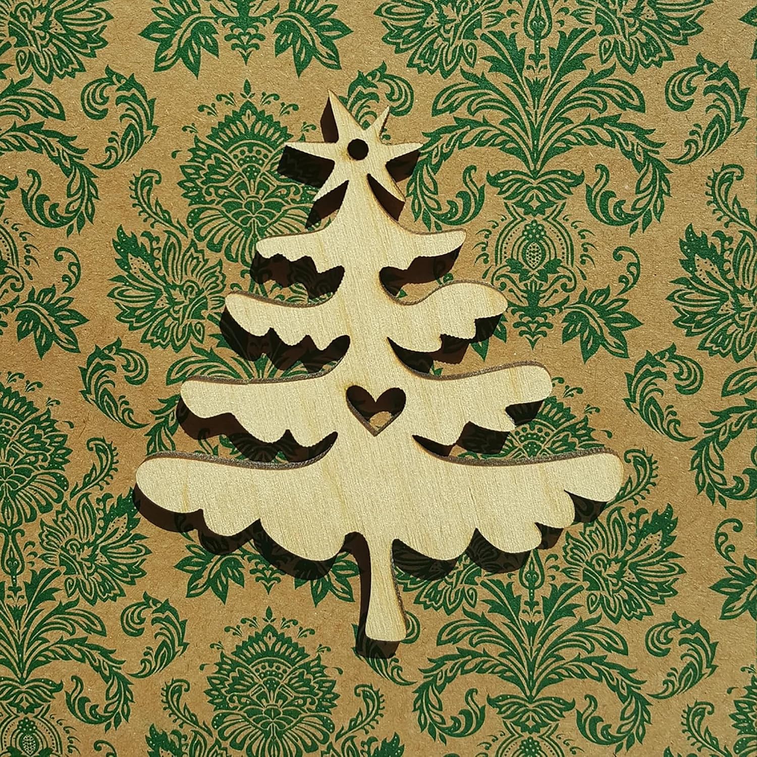 Wooden Christmas tree decoration on a patterned paper background