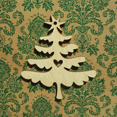Wooden Christmas tree decoration on a patterned paper background
