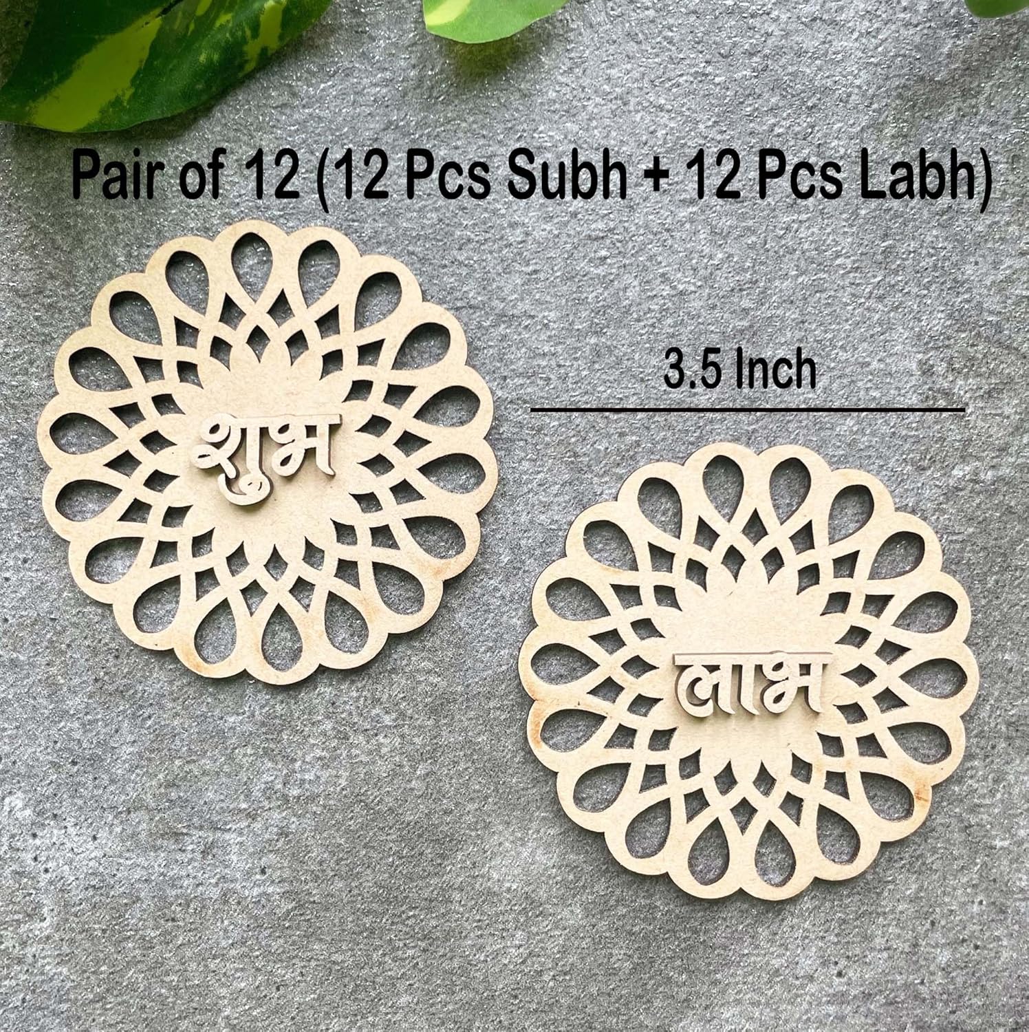 Two wooden decorative pieces with intricate designs on a gray surface.