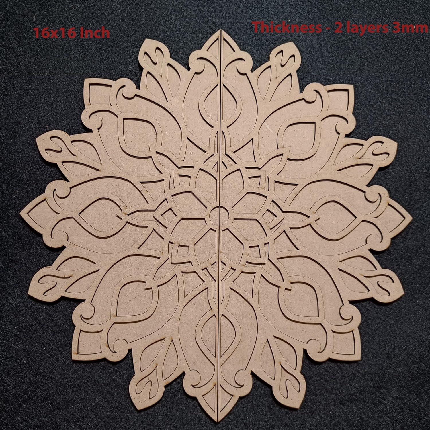 Decorative wooden cutout with intricate patterns on a black background