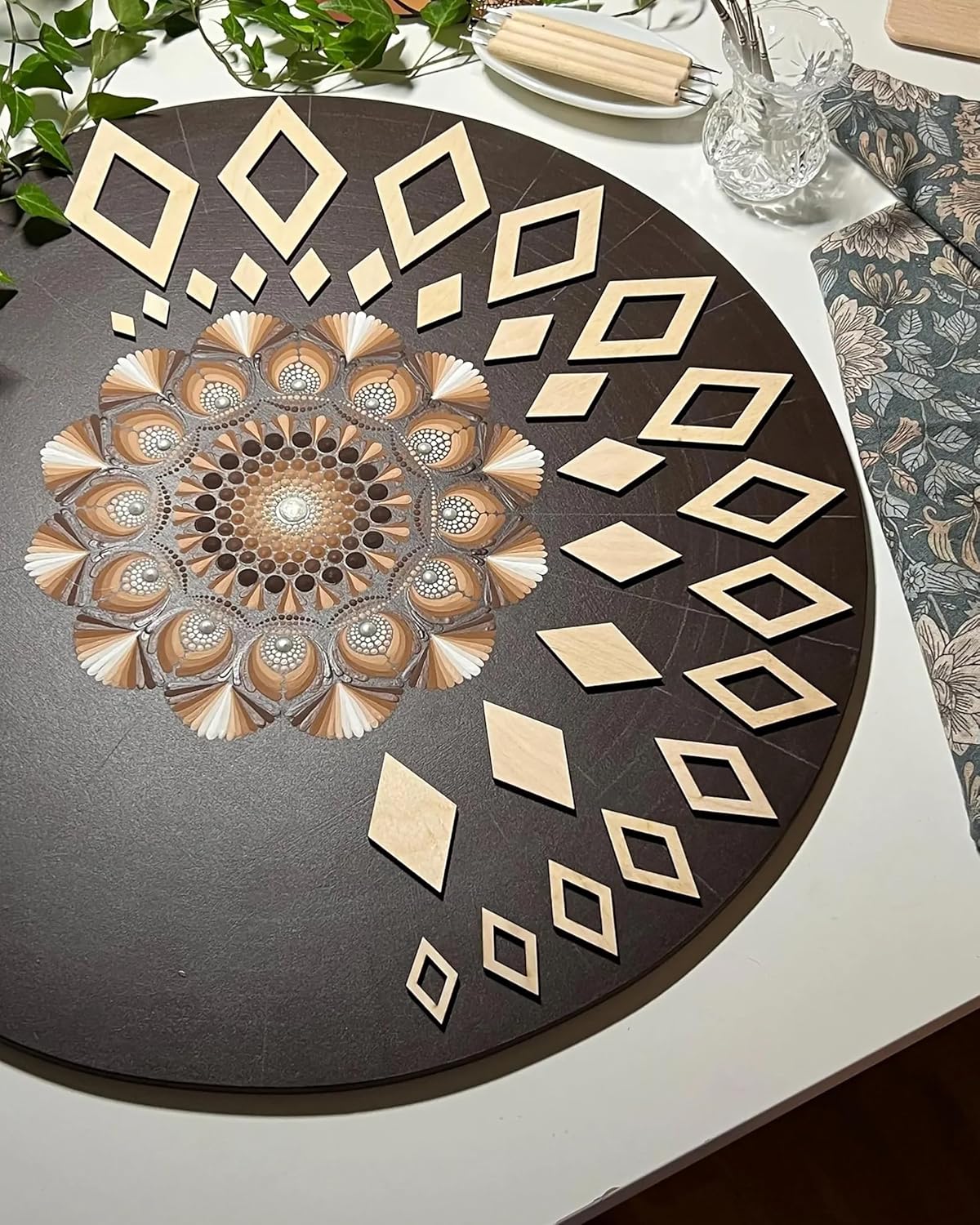 Decorative round mat with geometric patterns on a table