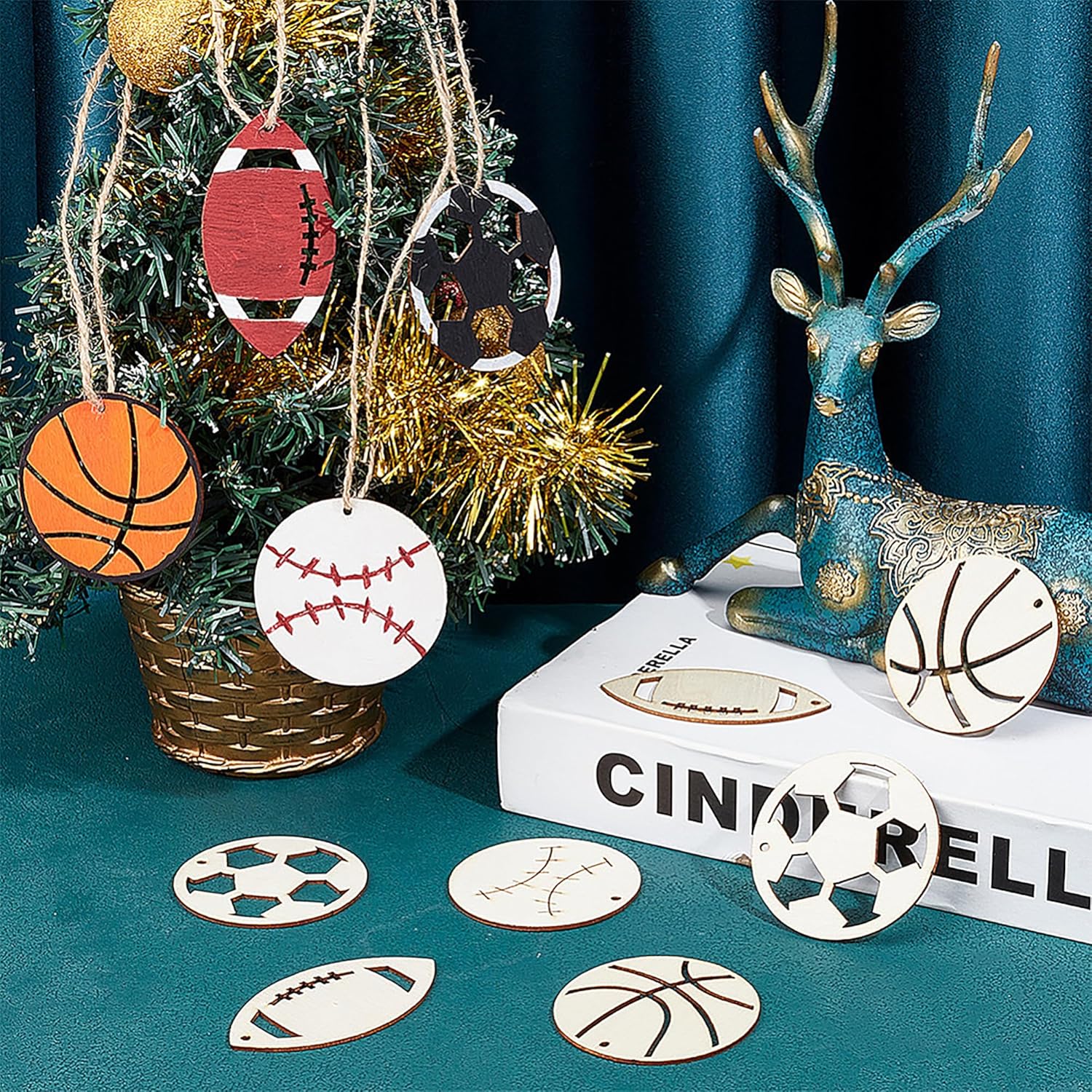 Decorative sports-themed ornaments on a Christmas tree with a blue deer figurine and books.