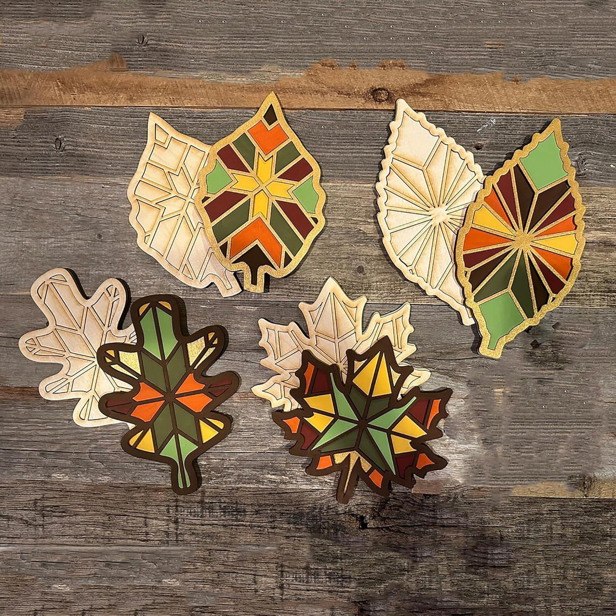 Colorful leaf-shaped cookies on a wooden surface