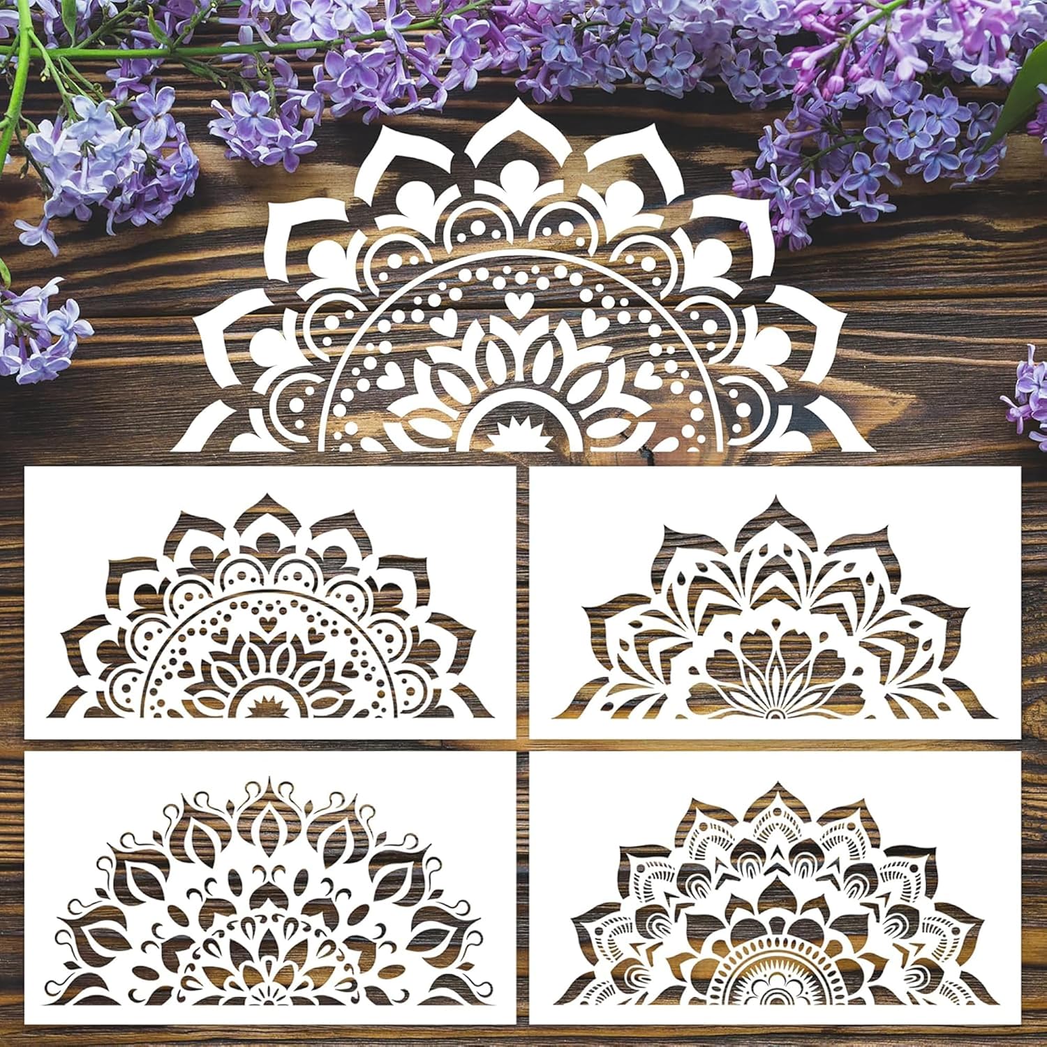 Set of six decorative mandala stencils on a wooden surface with purple flowers.