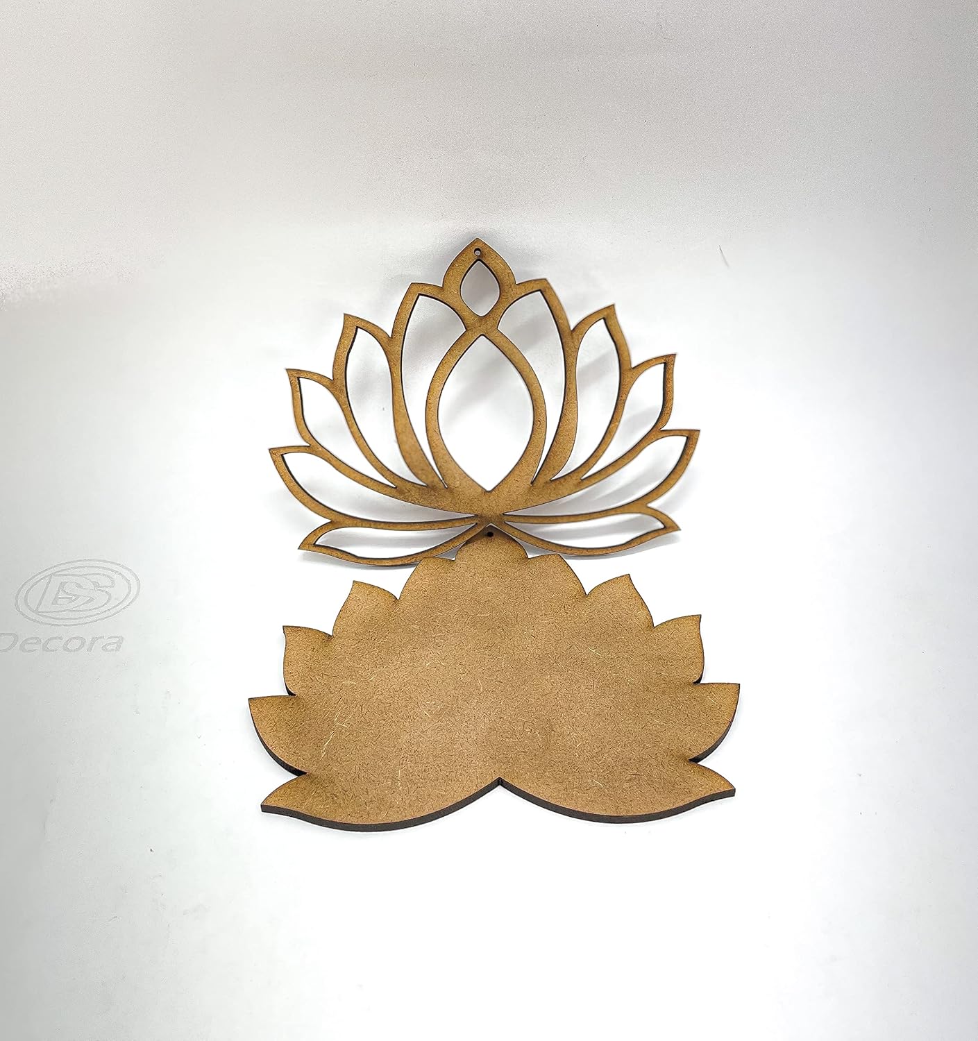 Wooden lotus flower wall decor on a white background