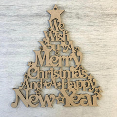 Wooden Christmas tree decoration with engraved text on a light wooden background