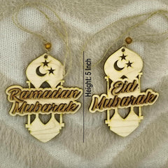 Two wooden decorations with 'Ramadan Mubarak' and 'Eid Mubarak' text on a textured background.