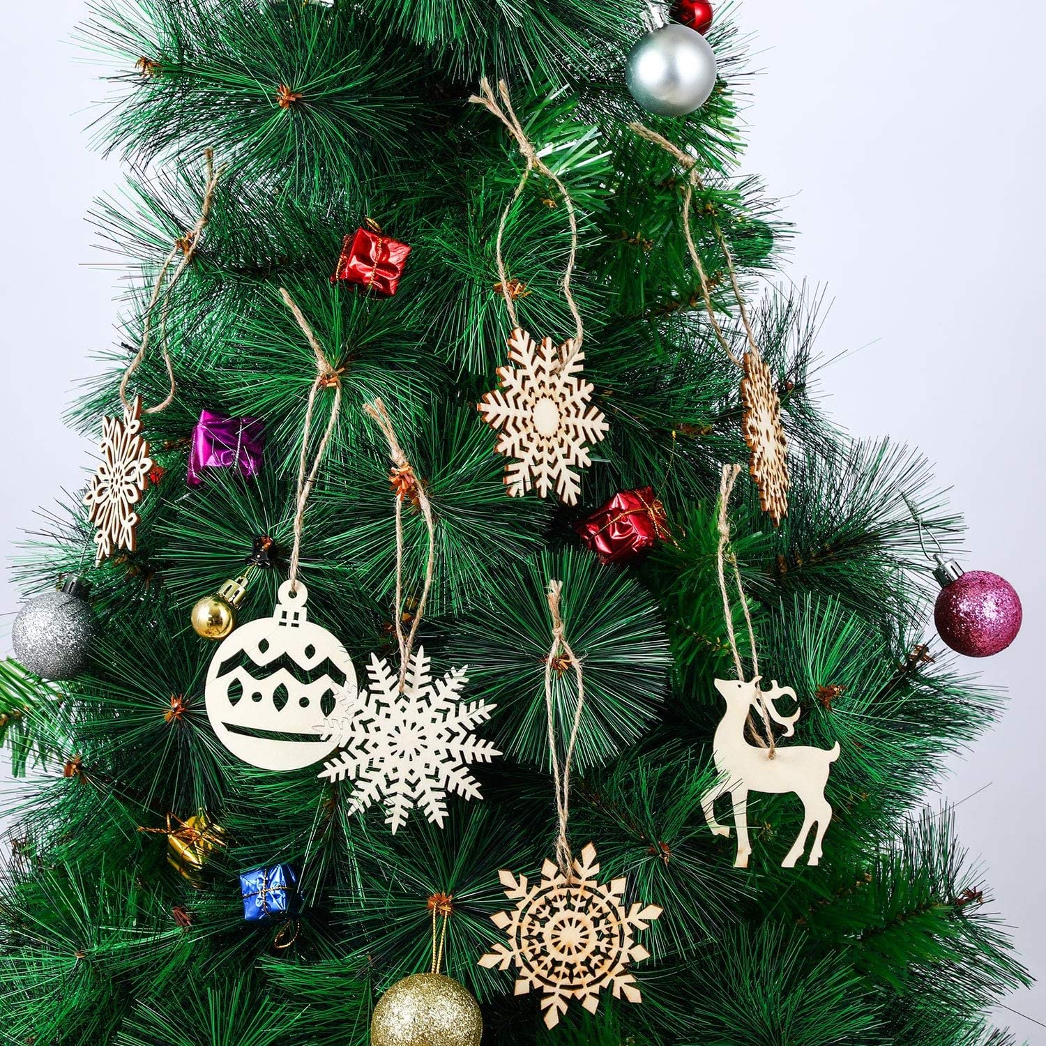 Decorative Christmas tree with various ornaments on a white background