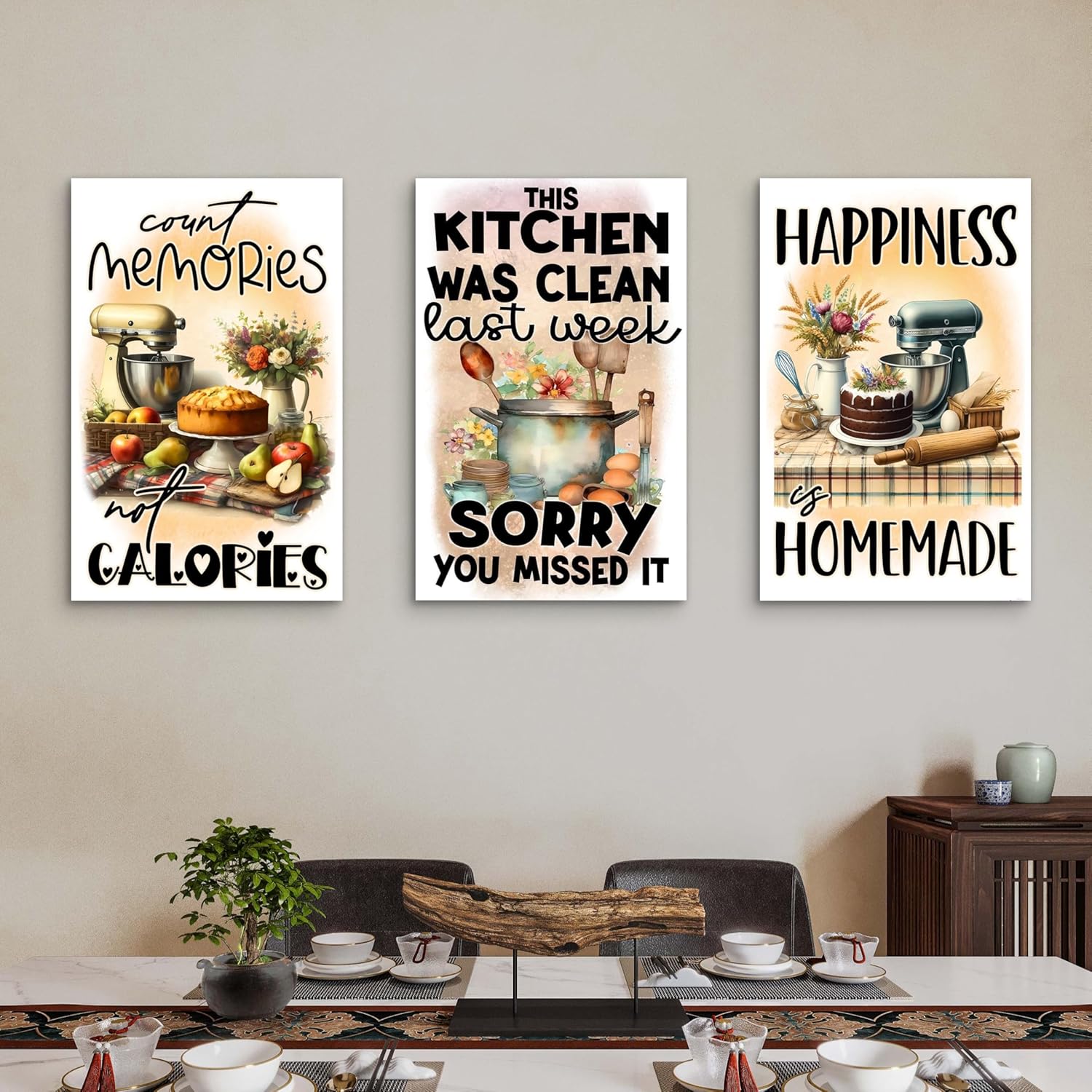 Three kitchen-themed wall posters on a wall above a dining table.