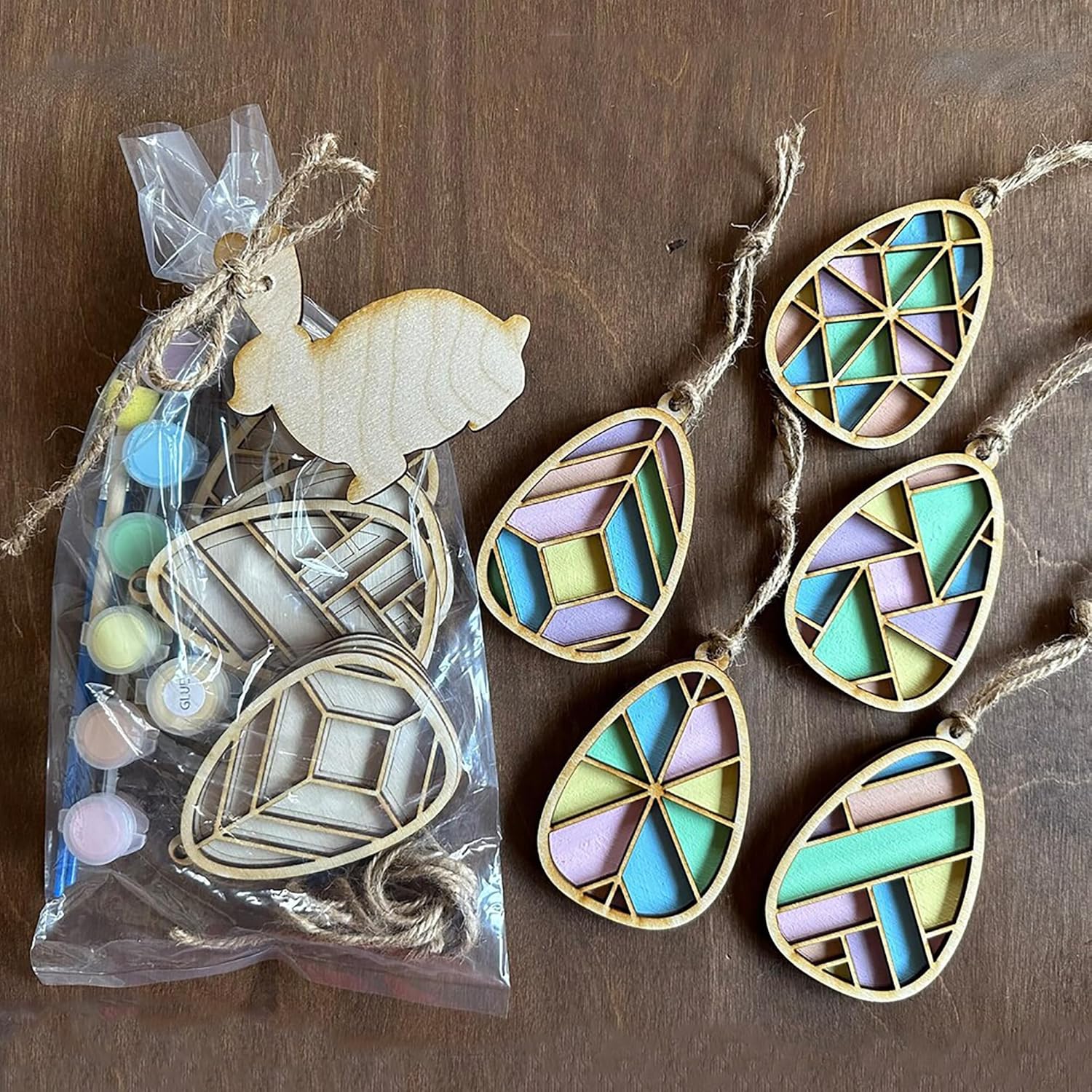 Decorative stained glass ornaments on a wooden surface