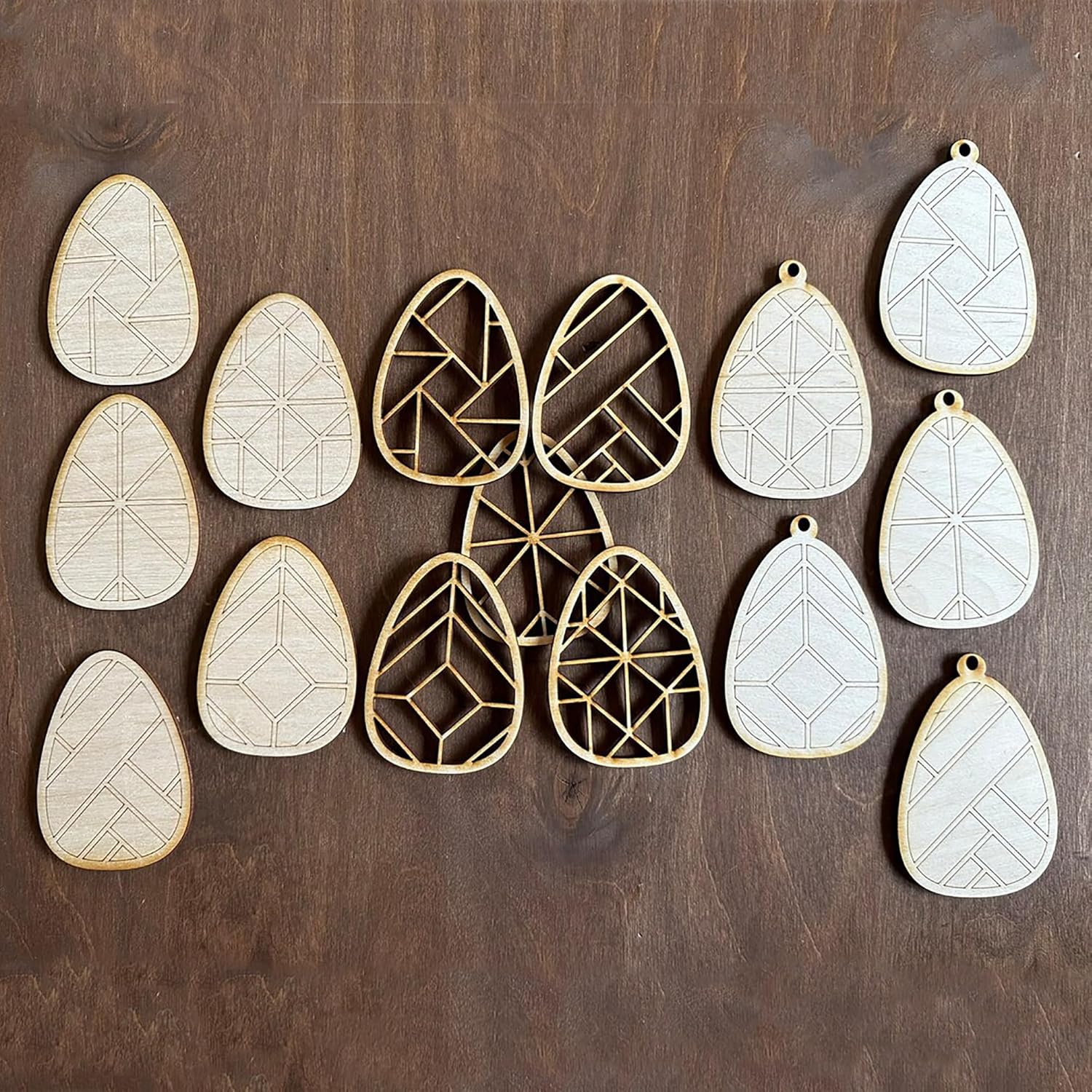 Geometrically patterned earrings on a wooden surface