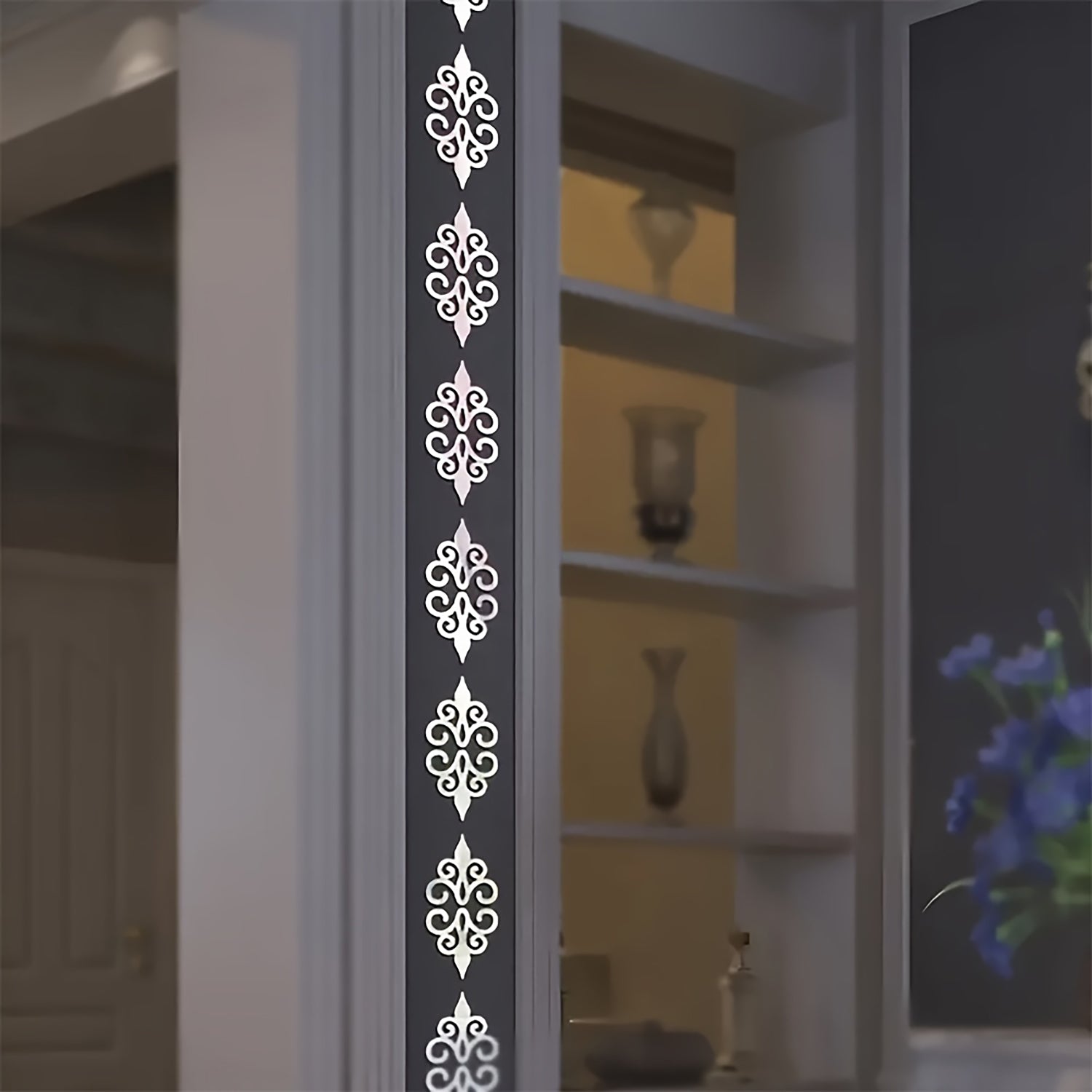 Decorative wall decal with intricate patterns on a plain wall.