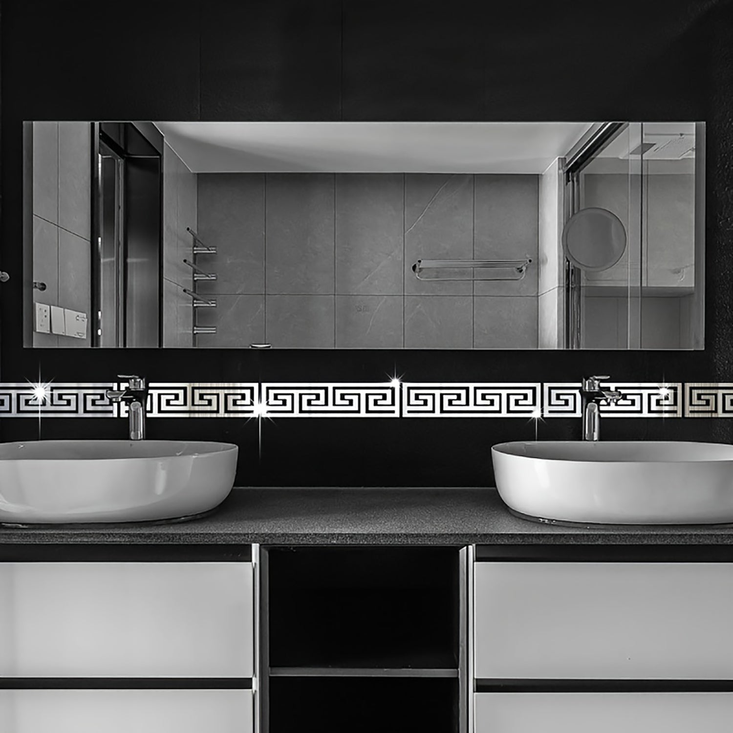 Bathroom vanity with two sinks and a large mirror above.