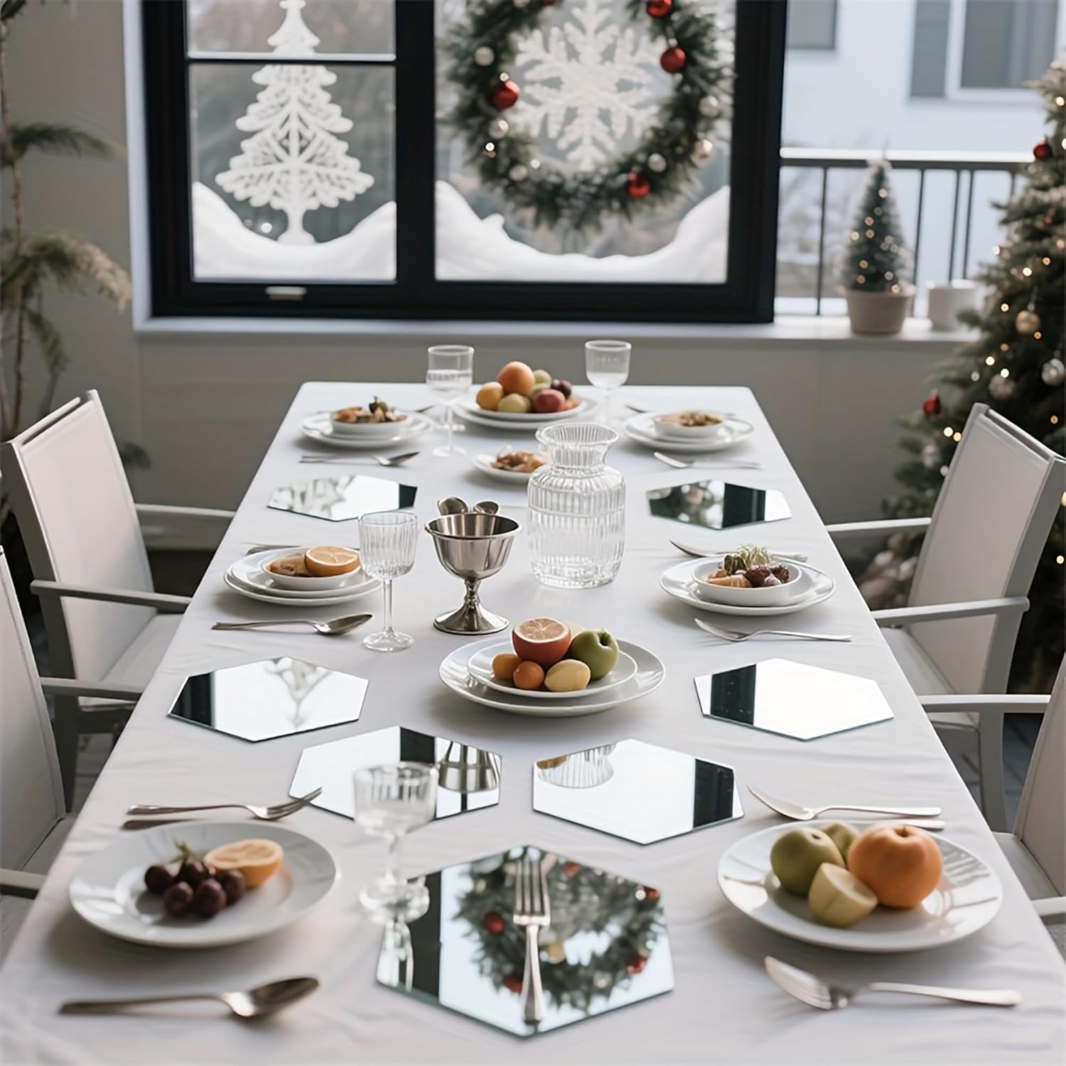 Dining table set for a meal with plates, glasses, and silverware in a festive room.