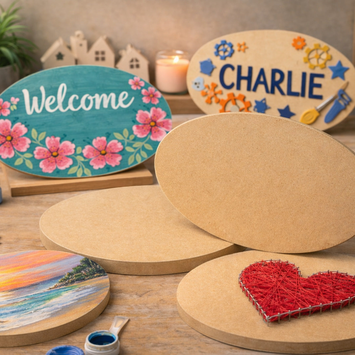Decorative wooden signs with painted designs on a wooden surface.