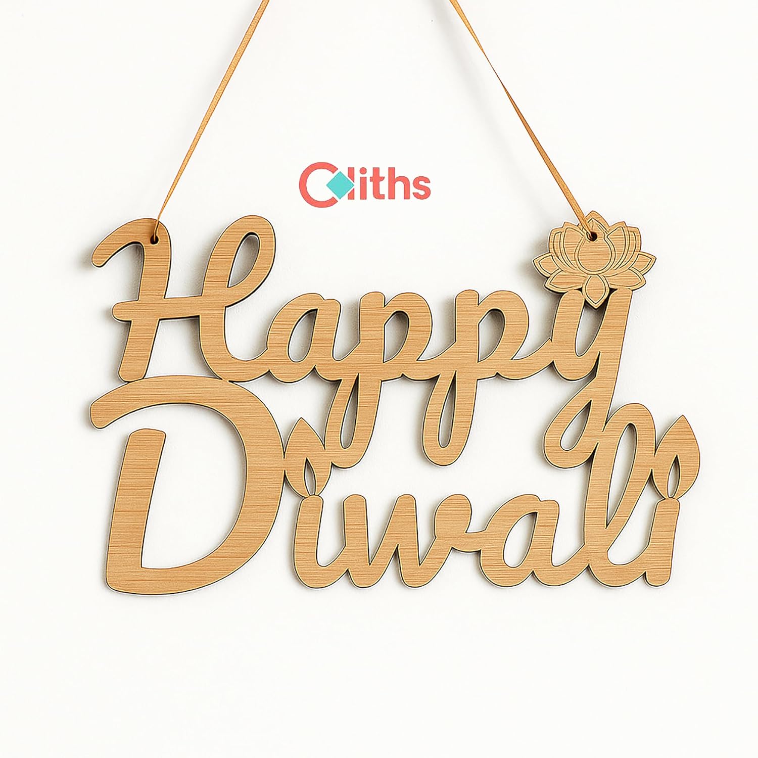 Wooden decorative hanging with 'Happy Diwali' text and a lotus flower, branded with 'Coiths'.