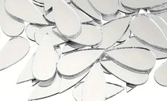 Close-up of a clear glass chandelier with reflective surface