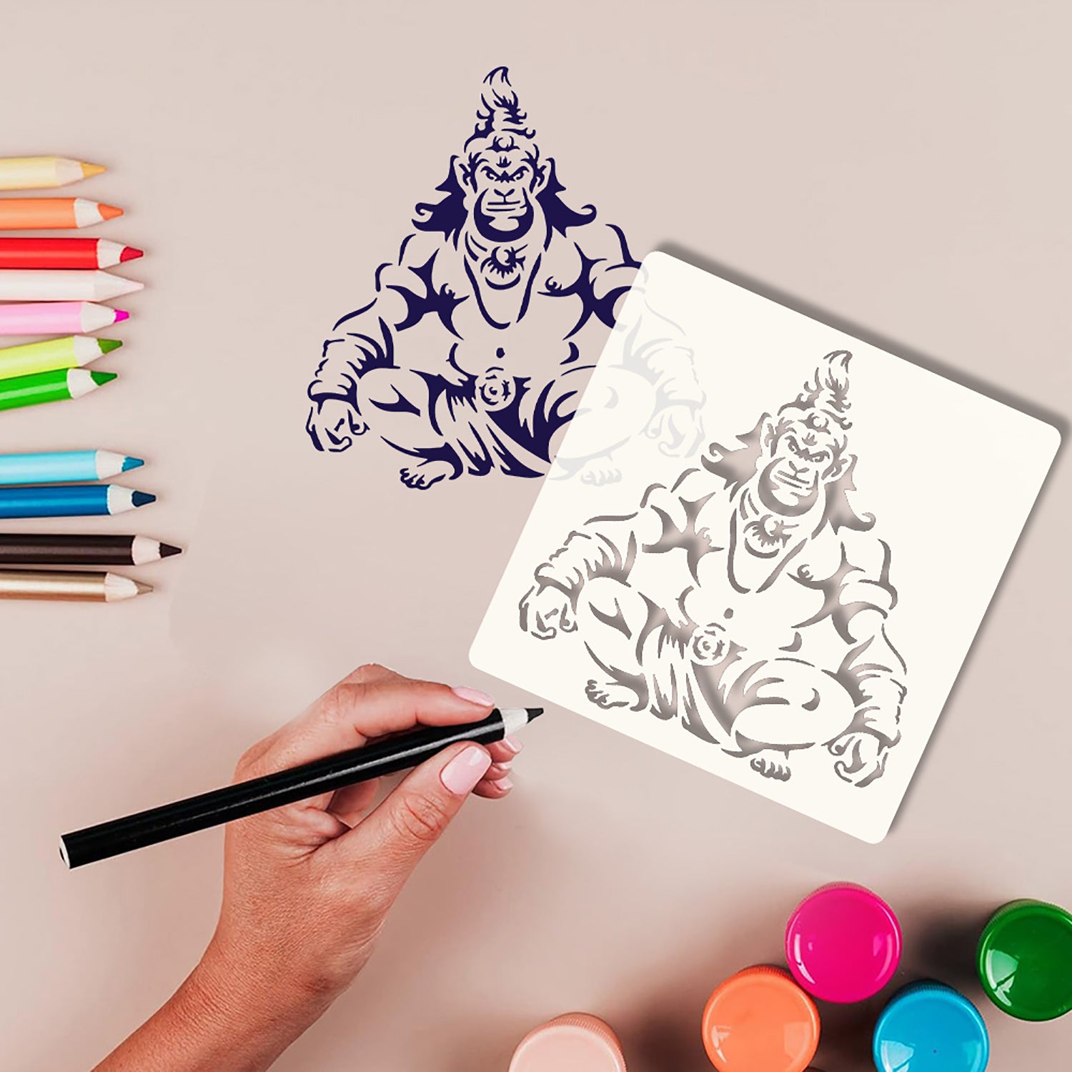 Stylized drawing of a creature on a white sheet with colored pencils and paint bottles on a beige background