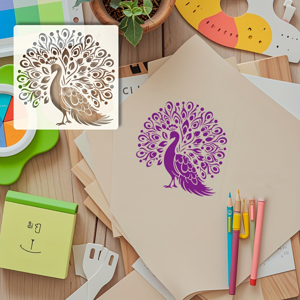 Peacock design stencil on paper with stationery items on a wooden surface