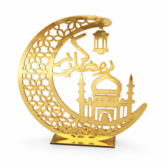 Gold decorative item shaped like a crescent moon with a mosque silhouette on a white background