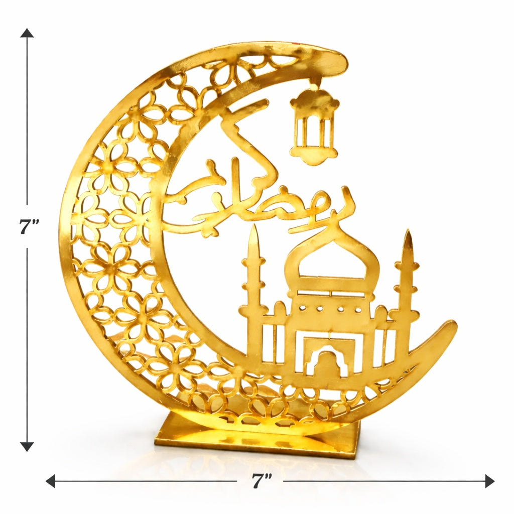 Decorative gold crescent moon with intricate designs on a white background