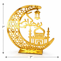 Decorative gold crescent moon with intricate designs on a white background