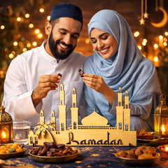 Couple enjoying Ramadan treats with a decorative mosque model and lanterns in the background.