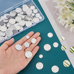 White round sequins on a hand with a teal surface and floral background