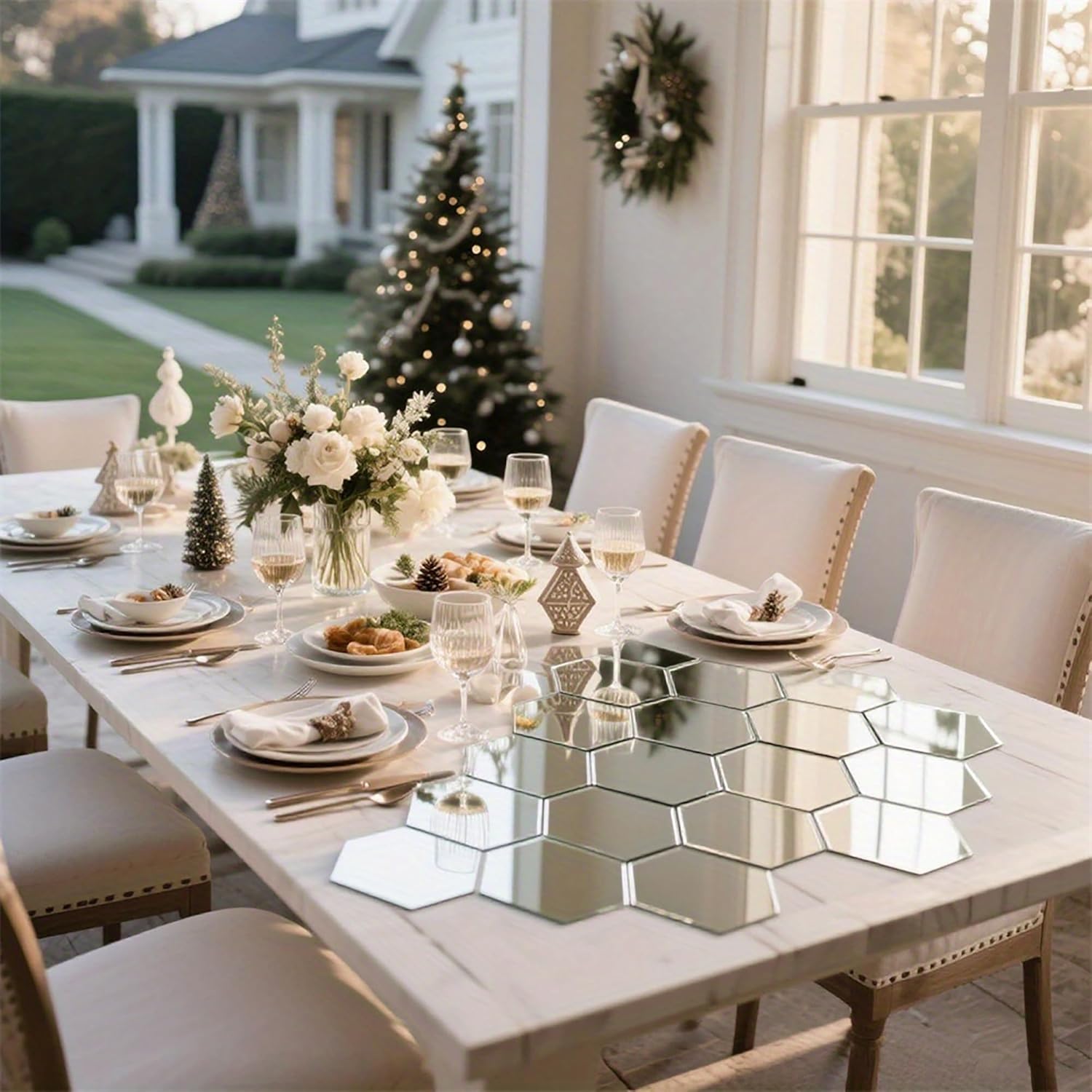 Dining room table set for a meal with decorative elements, including a Christmas tree in the background.