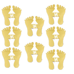 Gold foot-shaped stickers with a swastika symbol on a white background