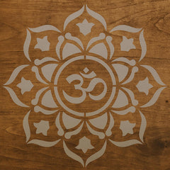 Decorative Om symbol with floral patterns on a wooden background
